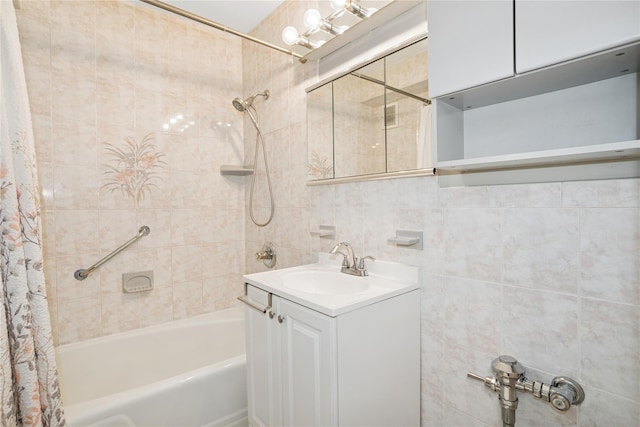 153-25 88th St Unit 1F, Howard Beach, NY 11414 - full bath featuring vanity, visible vents, shower / tub combo, and tile walls