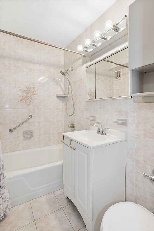153-25 88th St Unit 1F, Howard Beach, NY 11414 - bathroom featuring vanity, tile patterned floors, toilet, and tile walls