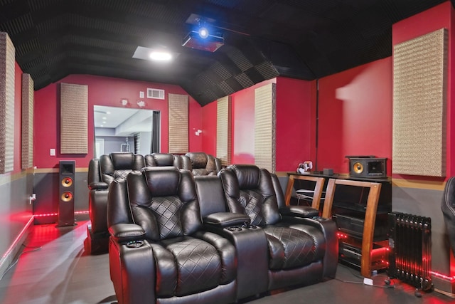 cinema room with vaulted ceiling and visible vents
