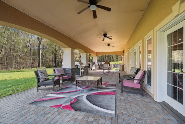 view of patio / terrace featuring ceiling fan and an outdoor hangout area