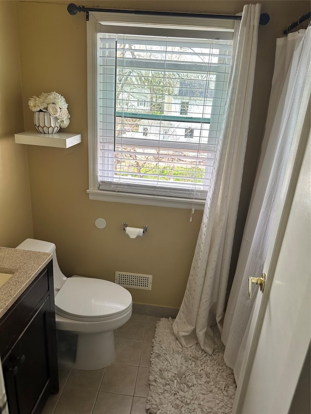bathroom featuring vanity, toilet, tile patterned flooring, and visible vents