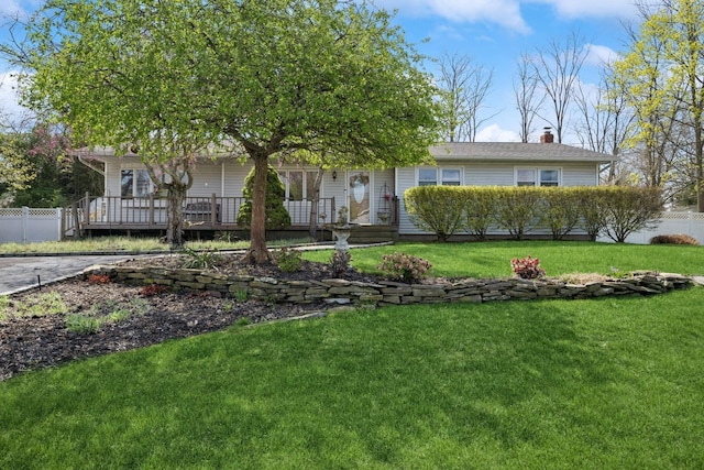 24 Linda Ln, East Moriches, NY 11940 - single story home with a front lawn, a chimney, and fence