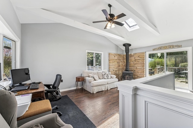 24 Linda Ln, East Moriches, NY 11940 - home office with a ceiling fan, lofted ceiling with skylight, a wood stove, baseboards, and dark wood-type flooring