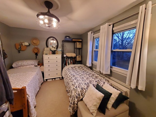 bedroom featuring light colored carpet