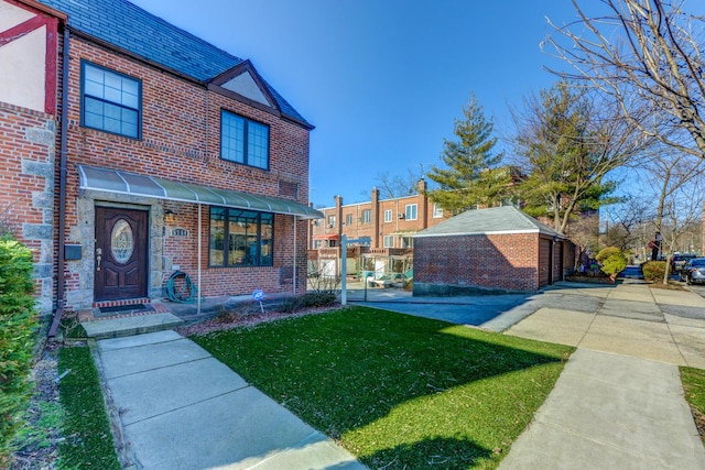 67-54 Groton St, Forest Hills, NY 11375 - view of front facade with brick siding and a front yard