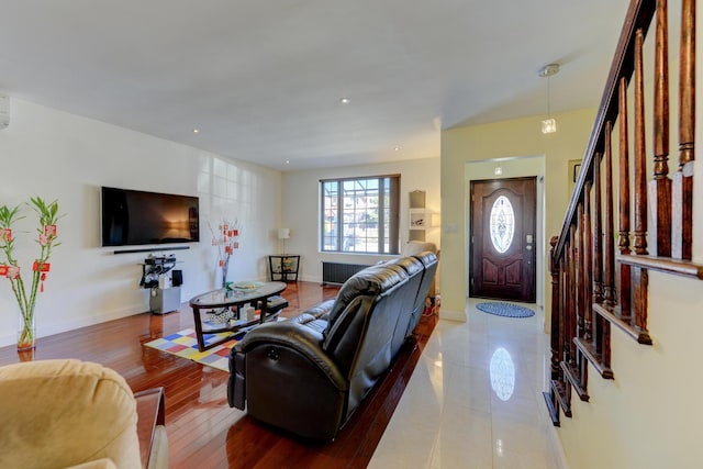 67-54 Groton St, Forest Hills, NY 11375 - living room with baseboards, stairs, and wood finished floors