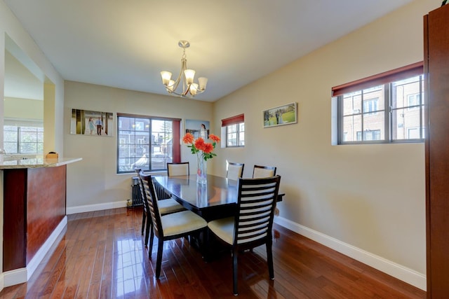 67-54 Groton St, Forest Hills, NY 11375 - dining space with baseboards, a chandelier, and dark wood finished floors