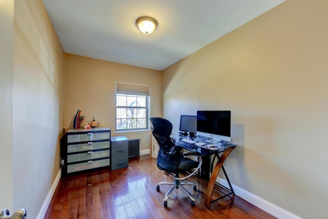 67-54 Groton St, Forest Hills, NY 11375 - office area featuring baseboards, radiator heating unit, and hardwood / wood-style flooring