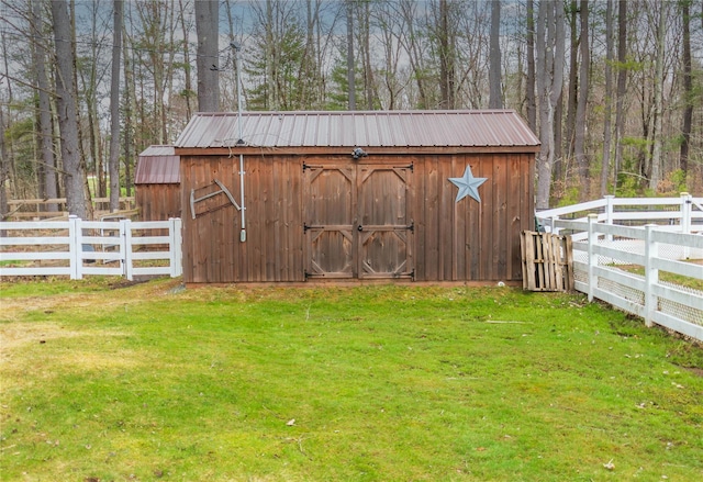 view of shed with fence
