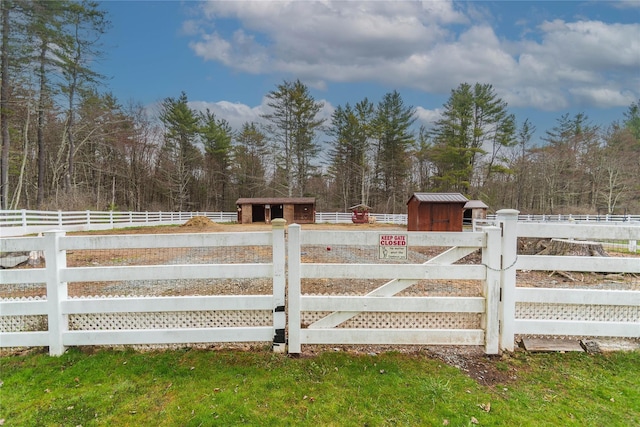 view of gate with fence