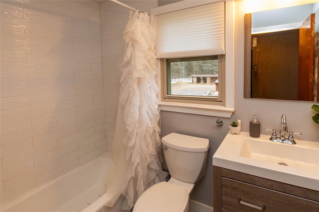 full bath featuring shower / tub combo with curtain, toilet, and vanity