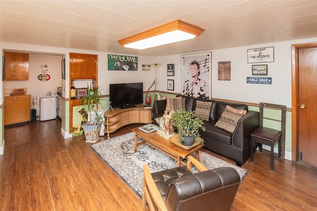 living room featuring baseboards and wood finished floors
