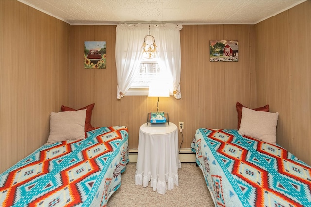 carpeted bedroom with a baseboard heating unit