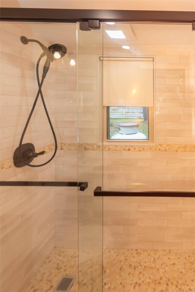 bathroom with visible vents and a stall shower