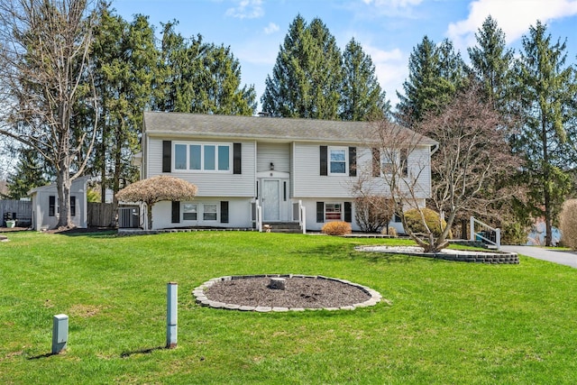 split foyer home with a front lawn