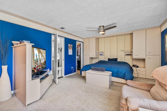 bedroom featuring visible vents, a closet, crown molding, a textured ceiling, and light colored carpet