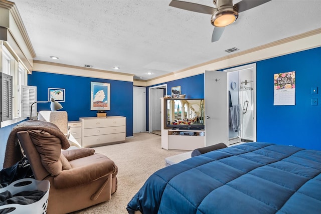 carpeted bedroom with visible vents, a textured ceiling, recessed lighting, and ornamental molding