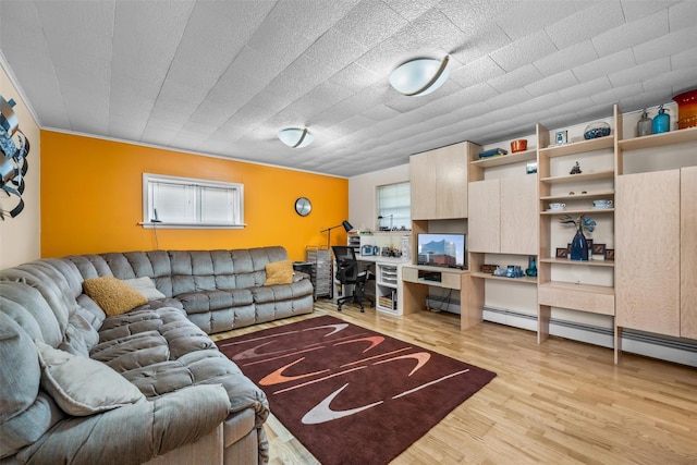 living area with built in study area, a wealth of natural light, and light wood finished floors