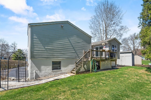 rear view of property featuring a yard, an outbuilding, a deck, and stairs