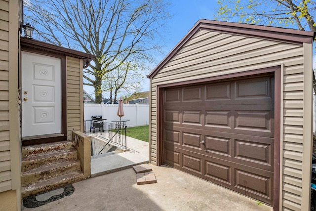 detached garage with fence