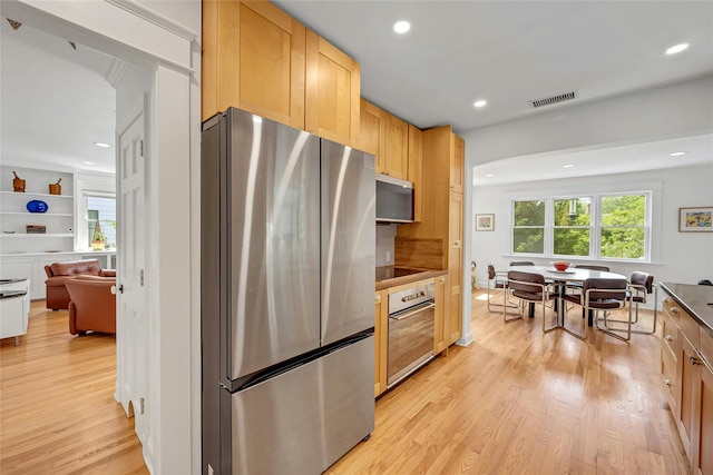 7 Senate Pl, Larchmont, NY 10538 - kitchen with appliances with stainless steel finishes, light wood finished floors, and recessed lighting