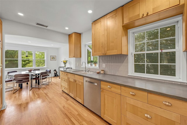 7 Senate Pl, Larchmont, NY 10538 - kitchen with stainless steel dishwasher, a sink, light wood-style flooring, dark countertops, and recessed lighting