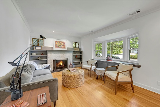 7 Senate Pl, Larchmont, NY 10538 - living area with ornamental molding, light wood-style flooring, a premium fireplace, baseboards, and recessed lighting
