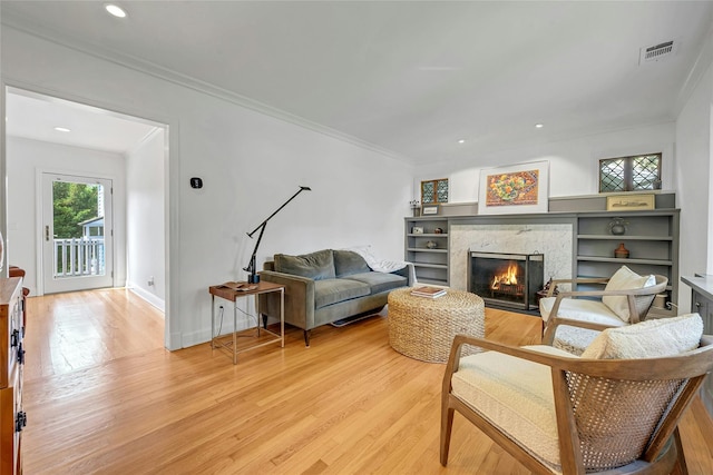 7 Senate Pl, Larchmont, NY 10538 - living area featuring light wood finished floors, a premium fireplace, crown molding, recessed lighting, and baseboards