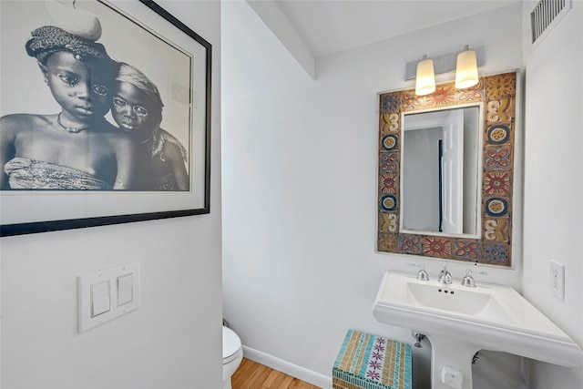 7 Senate Pl, Larchmont, NY 10538 - half bath with toilet, wood finished floors, and baseboards