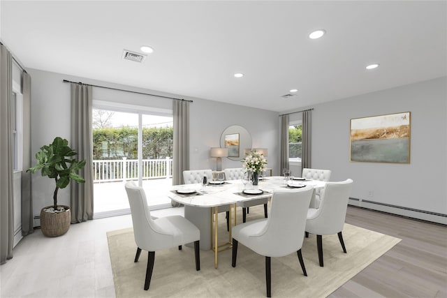 dining area featuring healthy amount of natural light, light wood finished floors, recessed lighting, and a baseboard heating unit
