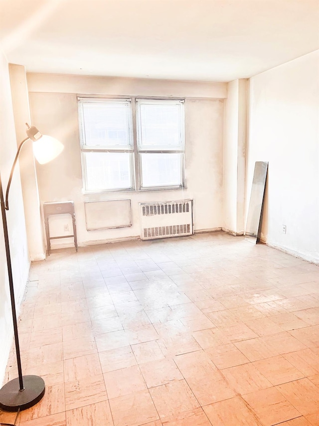 138-10 Franklin Ave Unit 10G, Flushing, NY 11355 - unfurnished room featuring baseboards and radiator