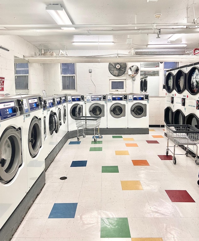 138-10 Franklin Ave Unit 10G, Flushing, NY 11355 - common laundry area featuring tile patterned floors and separate washer and dryer