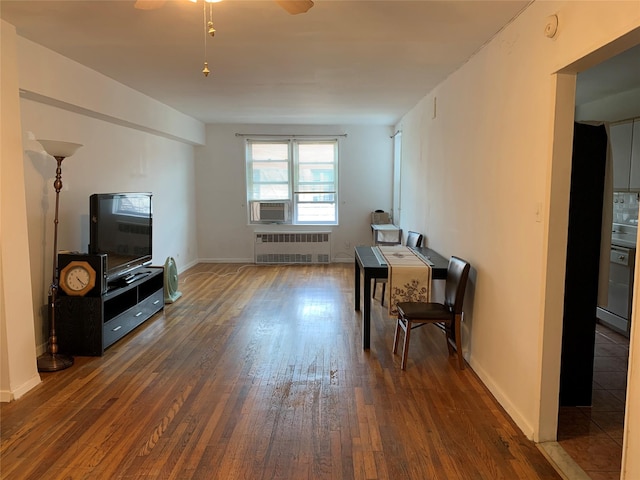 42-40 Bowne St Unit 6D, Flushing, NY 11355 - living area with radiator, wood-type flooring, a ceiling fan, and baseboards