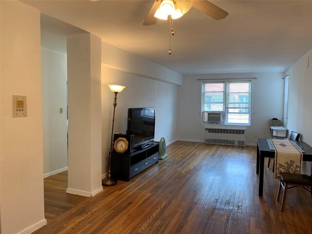 42-40 Bowne St Unit 6D, Flushing, NY 11355 - living area featuring radiator, wood finished floors, baseboards, and a ceiling fan