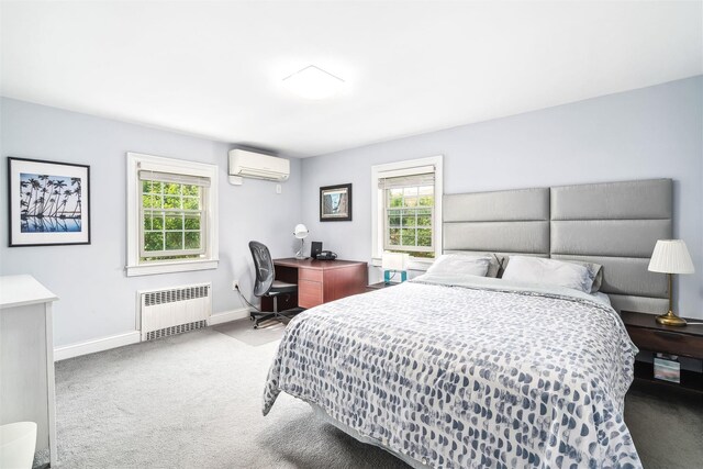 bedroom featuring multiple windows, a wall mounted AC, carpet floors, and radiator
