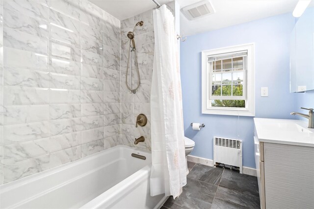 bathroom featuring vanity, toilet, visible vents, radiator heating unit, and shower / bath combination with curtain