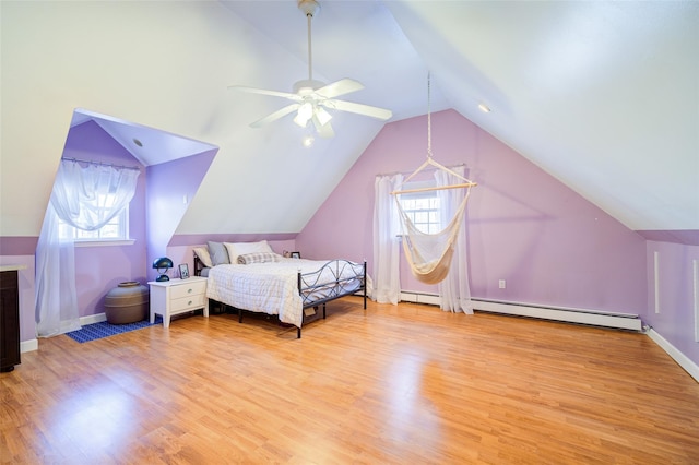bedroom with light wood-type flooring, baseboards, lofted ceiling, baseboard heating, and a ceiling fan