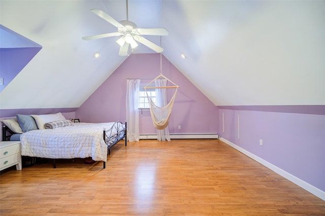 bedroom featuring baseboards, a ceiling fan, wood finished floors, and vaulted ceiling