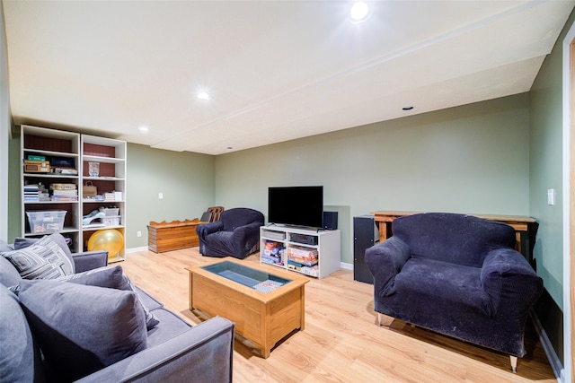 living area with recessed lighting, light wood-style floors, and baseboards