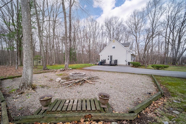 view of yard with a fire pit