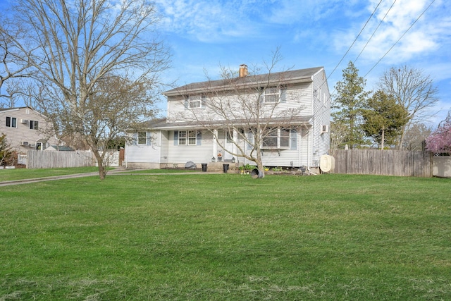 exterior space featuring fence and a front yard