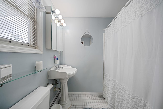 full bath with tile patterned flooring, toilet, a shower with curtain, baseboards, and baseboard heating
