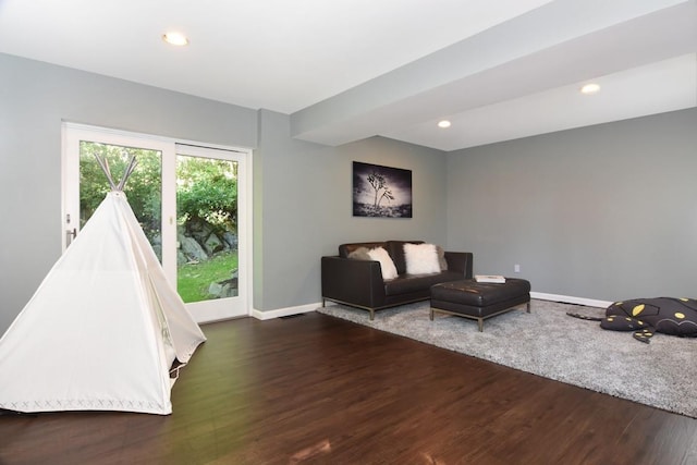 recreation room with wood finished floors, baseboards, and recessed lighting