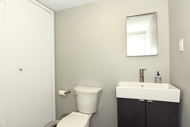 bathroom with toilet and a sink