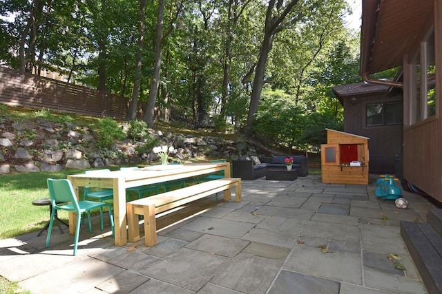 view of patio / terrace featuring fence, outdoor lounge area, and outdoor dining space