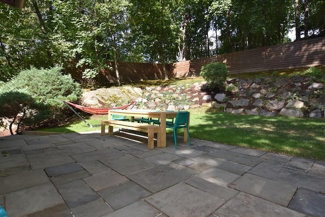 view of patio / terrace featuring fence and outdoor dining area