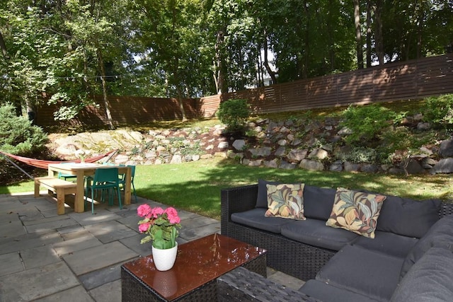 view of patio / terrace featuring a fenced backyard, outdoor dining area, and outdoor lounge area