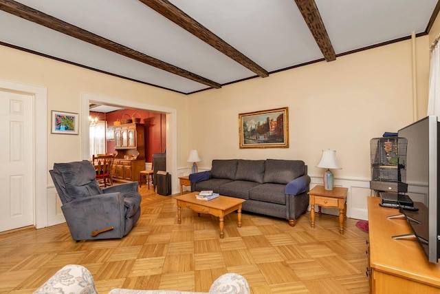 living room with an inviting chandelier and beam ceiling