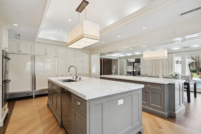 99 Wheatley Rd, Old Westbury, NY 11568 - kitchen with a sink, gray cabinets, dishwasher, a center island with sink, and visible vents