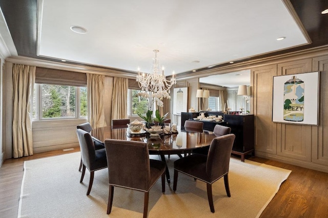 99 Wheatley Rd, Old Westbury, NY 11568 - dining room with a chandelier, light wood-style flooring, crown molding, and recessed lighting